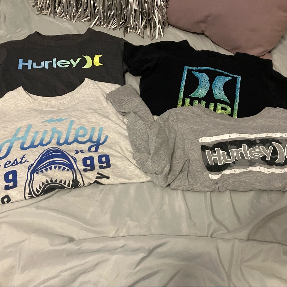 3 short sleeve 1 long sleeve used in good condition 10/12 hurley shirts